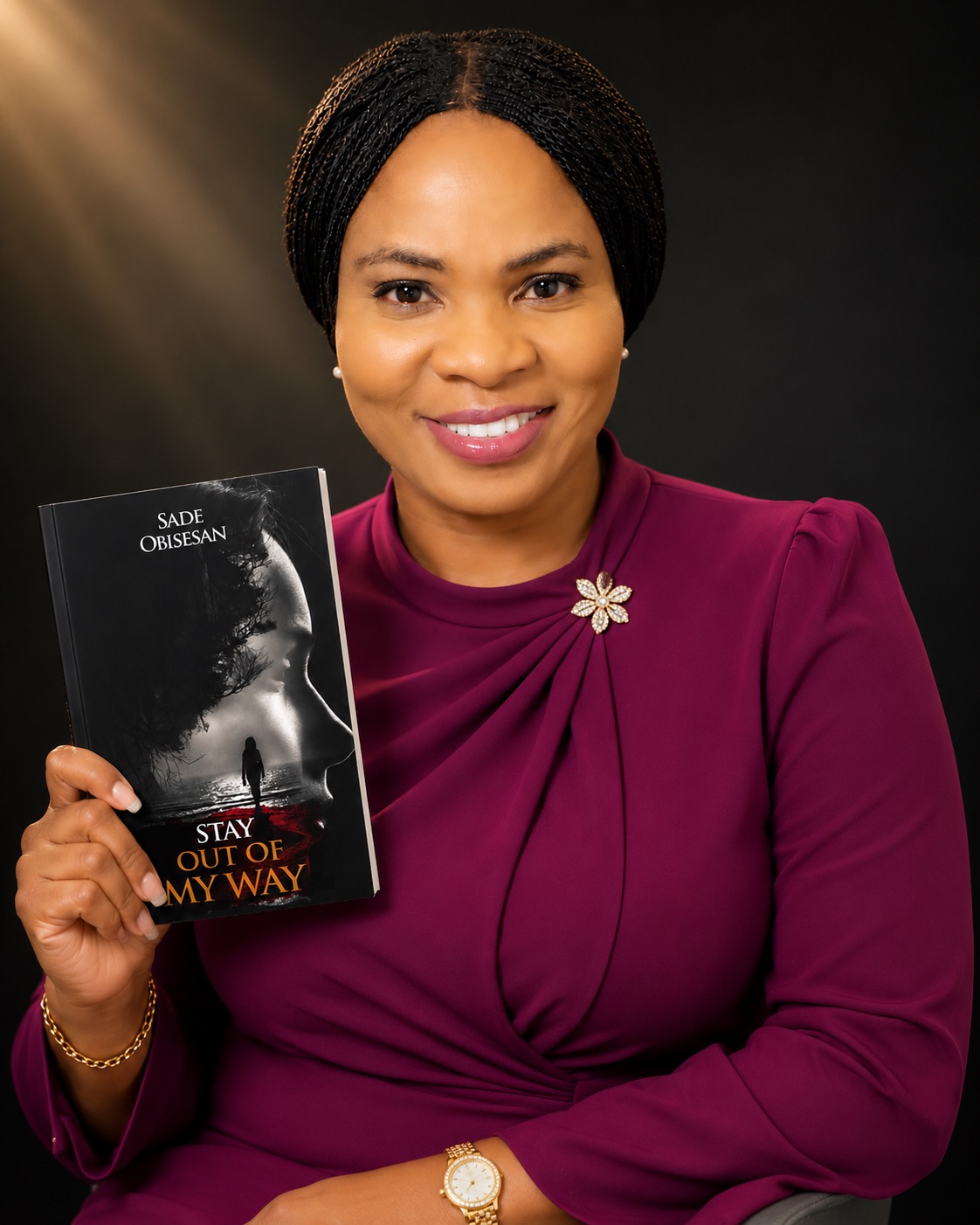 Sade Obisesan holding Stay Out Of My Way
